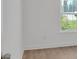 Bedroom features hardwood floors, a window view, and fresh white paint at 1075 Peachtree Ne Walk # A421, Atlanta, GA 30309