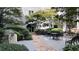 Picturesque courtyard featuring landscaping, a waterfall, and a sitting area at 1075 Peachtree Ne Walk # A421, Atlanta, GA 30309