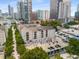 Building exterior surrounded by trees, with parking at 1075 Peachtree Ne Walk # A421, Atlanta, GA 30309
