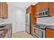 A modern kitchen with stainless steel appliances, granite countertops, and ample cabinet space at 1075 Peachtree Ne Walk # A421, Atlanta, GA 30309