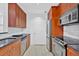A modern kitchen with stainless steel appliances, granite countertops, and ample cabinet space at 1075 Peachtree Ne Walk # A421, Atlanta, GA 30309