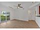 Living room with hardwood floors and sliding glass doors to a balcony at 1075 Peachtree Ne Walk # A421, Atlanta, GA 30309