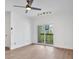 Living room with hardwood floors and sliding glass doors to a balcony at 1075 Peachtree Ne Walk # A421, Atlanta, GA 30309