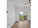 Bright living room features hardwood floors and sliding door to a balcony at 1075 Peachtree Ne Walk # A421, Atlanta, GA 30309