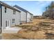 Backyard view of the property highlighting a newly built patio and expansive green space at 120 Hampton Ter, Dallas, GA 30157