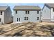 Rear of home shows backyard with patio, large windows, gray siding, and space between neighbors at 120 Hampton Ter, Dallas, GA 30157