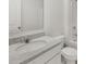 Well lit bathroom featuring granite countertops, white cabinetry, and modern fixtures at 120 Hampton Ter, Dallas, GA 30157