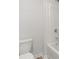 Clean bathroom featuring white fixtures, including a toilet, tub, and shower with a new enclosure at 120 Hampton Ter, Dallas, GA 30157