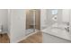 Beautiful bathroom featuring a tiled shower, soaking tub, and double vanity at 120 Hampton Ter, Dallas, GA 30157