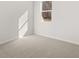 Bedroom with neutral carpet, white walls and a window with a view of the wooded area at 120 Hampton Ter, Dallas, GA 30157