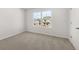 Bright bedroom with neutral carpet and a large window offering a view of the outdoors at 120 Hampton Ter, Dallas, GA 30157