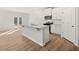 Modern kitchen with white cabinets, stainless steel appliances, and a stylish island with granite countertops at 120 Hampton Ter, Dallas, GA 30157