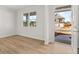 Bright living room with light hardwood floors, large windows, and a view of the home's exterior at 120 Hampton Ter, Dallas, GA 30157