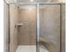 Tiled shower with a glass door and built-in seat at 120 Hampton Ter, Dallas, GA 30157