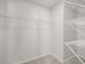 Spacious walk-in closet with multiple shelves for optimal organization at 120 Hampton Ter, Dallas, GA 30157