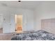 Cozy bedroom with ensuite bathroom access, carpet floors, neutral colors, and a view into the bath at 1263 Harvest Park Ln, Suwanee, GA 30024