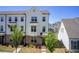Charming townhome showcasing a beautifully landscaped front yard at 1263 Harvest Park Ln, Suwanee, GA 30024