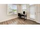 Bright office space with hardwood floors, natural light, and balcony access at 1263 Harvest Park Ln, Suwanee, GA 30024