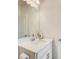 Well-lit powder room featuring a modern vanity and fixtures at 1263 Harvest Park Ln, Suwanee, GA 30024