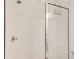 Modern walk-in shower featuring white subway tile, glass enclosure, and sleek fixtures at 1263 Harvest Park Ln, Suwanee, GA 30024