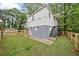 Exterior view of home featuring a fenced backyard, lawn, and access stairs at 298 Birch St, Atlanta, GA 30354