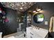 Updated bathroom featuring dark tile and a modern vanity and fixtures at 298 Birch St, Atlanta, GA 30354