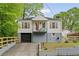 Charming home featuring a quaint front porch and a well-maintained yard at 298 Birch St, Atlanta, GA 30354