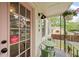 Charming front porch with seating, views of yard, and security system at 298 Birch St, Atlanta, GA 30354