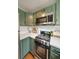 Eat-in kitchen with stainless steel appliances and ample counter space at 298 Birch St, Atlanta, GA 30354