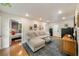 Bright living room with hardwood floors, cozy seating, and access to other rooms at 298 Birch St, Atlanta, GA 30354