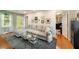 Inviting living room with a comfortable sectional and hardwood floors at 298 Birch St, Atlanta, GA 30354