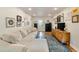 Bright living room with hardwood floors, cozy seating, and access to other rooms at 298 Birch St, Atlanta, GA 30354