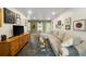 Bright and spacious living room with a large sectional and stylish decor at 298 Birch St, Atlanta, GA 30354