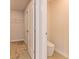 Hall bath featuring tile floor and low-flow toilet at 208 Crabapple St, Mcdonough, GA 30253