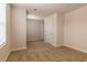 Spacious bedroom with neutral carpet, and windows offering plenty of natural light at 208 Crabapple St, Mcdonough, GA 30253