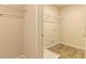 Walk in closet with wire shelving and vinyl flooring offers plenty of storage space at 208 Crabapple St, Mcdonough, GA 30253