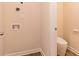 Laundry room with tile floors and access to half-bath at 208 Crabapple St, Mcdonough, GA 30253