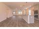 Bright, open-concept living area with hardwood floors connects seamlessly to the kitchen at 208 Crabapple St, Mcdonough, GA 30253