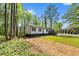 Charming single-story home with fresh exterior paint, manicured front yard, and a welcoming entrance at 2798 Hutchins Rd, Lawrenceville, GA 30044