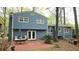 Spacious backyard with a red brick patio and a well-maintained lawn, perfect for outdoor living at 2912 Pathview Ln, Marietta, GA 30062