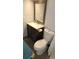 Bathroom featuring a dark wood vanity, a framed mirror, and a commode at 2912 Pathview Ln, Marietta, GA 30062