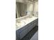 Functional bathroom featuring double sinks, ample counter space, and neutral finishes at 2912 Pathview Ln, Marietta, GA 30062