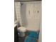 A shower and commode area featuring blue accents and a modern shower head at 2912 Pathview Ln, Marietta, GA 30062