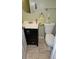 Compact bathroom with black vanity and toilet at 2912 Pathview Ln, Marietta, GA 30062
