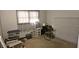 A simple bedroom space with carpeted floors and natural light from the window at 2912 Pathview Ln, Marietta, GA 30062