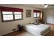 Bedroom featuring two windows, wooden floors, and a ceiling fan at 2912 Pathview Ln, Marietta, GA 30062