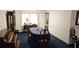 Classic dining room with traditional furniture, blue carpet, and ample natural light at 2912 Pathview Ln, Marietta, GA 30062