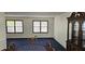 Traditional dining room with blue carpet, and a china cabinet at 2912 Pathview Ln, Marietta, GA 30062