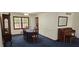 Traditional dining room with blue carpet, dark wood table, and china cabinet at 2912 Pathview Ln, Marietta, GA 30062