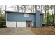 Exterior elevation of a blue home featuring white garage doors at 2912 Pathview Ln, Marietta, GA 30062